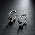 Polished silver metal hoop earrings with triple band wrap detail on dark texture - One Pair / Circle Style (X894-A)