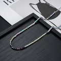 Irriserende geometrische kralenketting met zilveren karabijnsluiting en metalen ketting - Iristerend Hematiet Halsketting