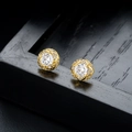 Macro shot of gold-plated round stud earrings featuring zircon and diamond-encrusted cross lines - Pave Zirconia Clover Stud Earrings / Gold