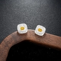 Macro shot of silver and gold vintage earrings featuring an engraved Fu symbol - Silver Style (X962-A)