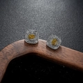 Macro detail of square vintage silver stud earrings with golden relief logo - Gunmetal Black Style (X962-C)