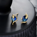 Golden snake stud earrings with dark blue oval gemstone and elegant wrap-around design - Gold Color Blue Zircon Snake