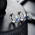 Macro shot of silver ear hoop with vintage relief and rectangular blue gemstone - Silver Blue (X983-A)
