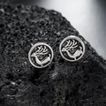 Retro silver elk stud earrings featuring embossed reindeer on a volcanic rock surface - Silver