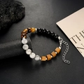 Detailed macro of multi-stone bead bracelet with tiger eye, onyx, and adjustable lobster clasp - White Tiger Eye Luck Bead Style