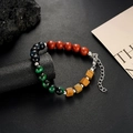 Macro detail of sandalwood beads bracelet with colorful stones and lobster clasp closure - Green Black Bead Style