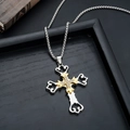 Close-up of two-tone cross necklace with white rhinestones and gothic filigree detail - Golden Illusion Cross (L8888-M)