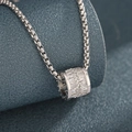 Macro shot of silver box chain necklace with a cylinder pendant inlaid with CZ diamonds - Silver Cylinder Rhinestone Style (L411-A)