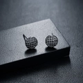 Macro shot of circular black stud earrings featuring a textured 3D prism pattern finish - Round Prism Style (X753-B) / Gunmetal