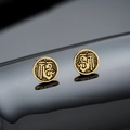 Macro shot of matte gold earrings with embossed Fu character and vintage cloud patterns - Double Fu Stud Earrings (Gold) / 8mm