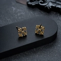 Detailed view of vintage gold cross earrings with black stones on a black display stand - Antique Gold Pair (X765-B)