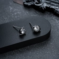 Macro detail of dark-toned stud earrings with clear round cubic zirconia and claw setting - Gun Black White Zirconia Style (X561-G)