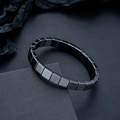 Polished square hematite bead bracelet for men on a dark geometric display stand - Square Bead Style (S528-B)