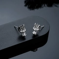 Macro detail of dragon head earring featuring antique silver finish and intricate carving - Stud Earrings / Silver