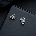 Detailed close-up of retro silver scorpion stud earrings with gothic punk textured metal - Scorpion Ear Clips (X1021-C) / Silver