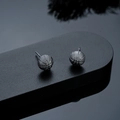 Detailed view of basketball earrings featuring matte black texture and realistic stitching - Stud Earrings / Gunmetal