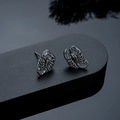 Macro shot of dark gunmetal scorpion stud earrings with a gothic punk aesthetic - Scorpion Stud Earrings (X1021-B) / Gunmetal