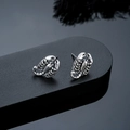Macro shot of silver scorpion studs with vintage oxidized metal texture details - Scorpion Stud Earrings (X1021-A) / Silver