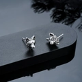 Macro shot of vintage silver wolf head earrings with detailed textured metallic finish - Silver (X1028-A)