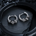 Detailed close-up of vintage hoop earrings with engraved scroll patterns on black stone - Ear Buckle / Retro Black (X1040-B)