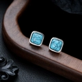Detailed view of vintage square turquoise studs with silver metal base on dark leather - Square Turquoise (X1061-A) / 8mm