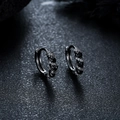 Macro detail of dark metal hoop earrings set with black and white pavé zircon stones - Gun Black Black Zirconia Pair