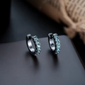 Macro detail of black huggie hoop earrings with light blue zircons in a channel setting - Gun Black Frame + Sea Blue Zirconia (1 Pair)
