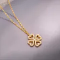 Elegante collana a quadrifoglio in argento S925 dorato con pavé di zirconi scintillanti - Oro