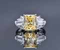 Macro shot of 925 silver ring featuring a yellow ice-cut gemstone and side stones - US 7 / Yellow Zirconia