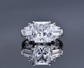Close-up of S925 silver ring with rectangular ice cut diamond and symmetrical reflection - US 7 / White Zirconia