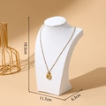 Golden necklace with round Roman numeral pendant on a white textured neck bust stand - 20cm Height / White Leather