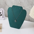 Blue heart pendant necklace with arrow detail on a green velvet bust display stand - Small Apple Style / Green Velvet