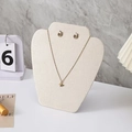 Golden butterfly necklace and hoop earrings jewelry set on a portrait display stand - Small Apple Style / Beige Velvet