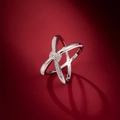 Elegant 925 sterling silver knot ring with sparkling crystals on deep red backdrop - US 6 / Silver