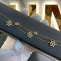 Double-layered gold snowflake bracelet with sparkling cubic zirconia floral pendants - 925 Silver / Gold