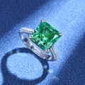 Elegant silver ring featuring a large radiant cut green gemstone with pavé diamond band - US 7 / Green