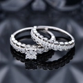 S925 zilveren trouwringset met witte diamanten en een golvend opengewerkt ontwerp - US 6 / Zilver