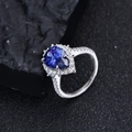 S925 Silberring mit birnenförmigem blauem Saphir und glitzerndem Diamant-Halo - US 6 / Tansanitblau