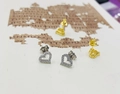 Detail of silver and gold heart stud earrings with cubic zirconia pave setting - 925 Silver / Silver
