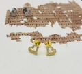 Detail showing S925 hallmark on gold and silver heart studs with cubic zirconia - 925 Silver / Gold