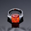 Radiant cut orange-red gemstone ring in 925 silver with baguette side stones - US 7 / Padparadscha Red