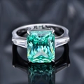 Three-stone silver ring featuring a 10.5ct emerald cut green radiant carbon diamond - US 6 / Paraiba Green