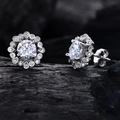 Silver flower-shaped stud earrings with 6mm clear center stone and halo setting - Earrings / White Rhinestone Ear Studs
