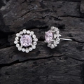 Pink gemstone earrings with floral halo in silver finish on dark wood background - Earrings / Pink Rhinestone Ear Studs