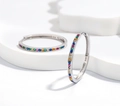 Detailed close-up of 925 sterling silver hoop earrings with colorful rainbow zircons - Large / Silver