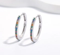 Macro shot of 925 sterling silver hoop earrings with colorful rainbow cubic zirconia - Small / Silver