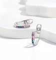 Macro shot of 925 silver U-shaped earrings with rainbow zircons and hallmark detail - Small Round Zirconia / 925 Silver / Silver
