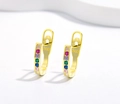 Macro detail of 925 silver U-shaped gold earrings featuring colorful pavé zircon stones - Small Round Zirconia / 925 Silver / Gold
