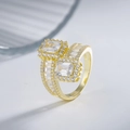 925 silver ring featuring emerald-cut stones and halo pave setting on gold band - US 6 / Gold