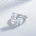 925 silver bypass ring with two square-cut stones and baguette side diamonds on white back - US 6 / White Gold
